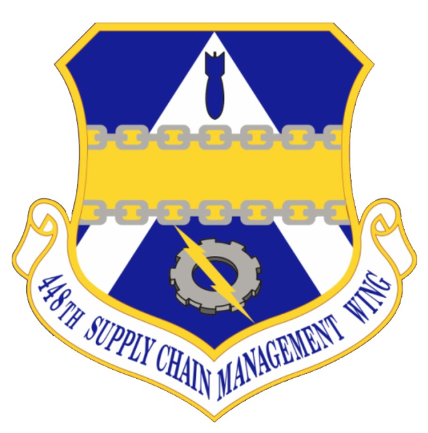 Logo des 48. Versorgungsmanagementgeschwaders mit einem blauen Schild mit einem weißen Stern und einem weißen Banner mit der Aufschrift "Versorgungsmanagement" in blau, alles von einem weißen Rand und schwarzem Text umgeben und mit der Aufschrift "48. Versorgungsmanagementgeschwader."